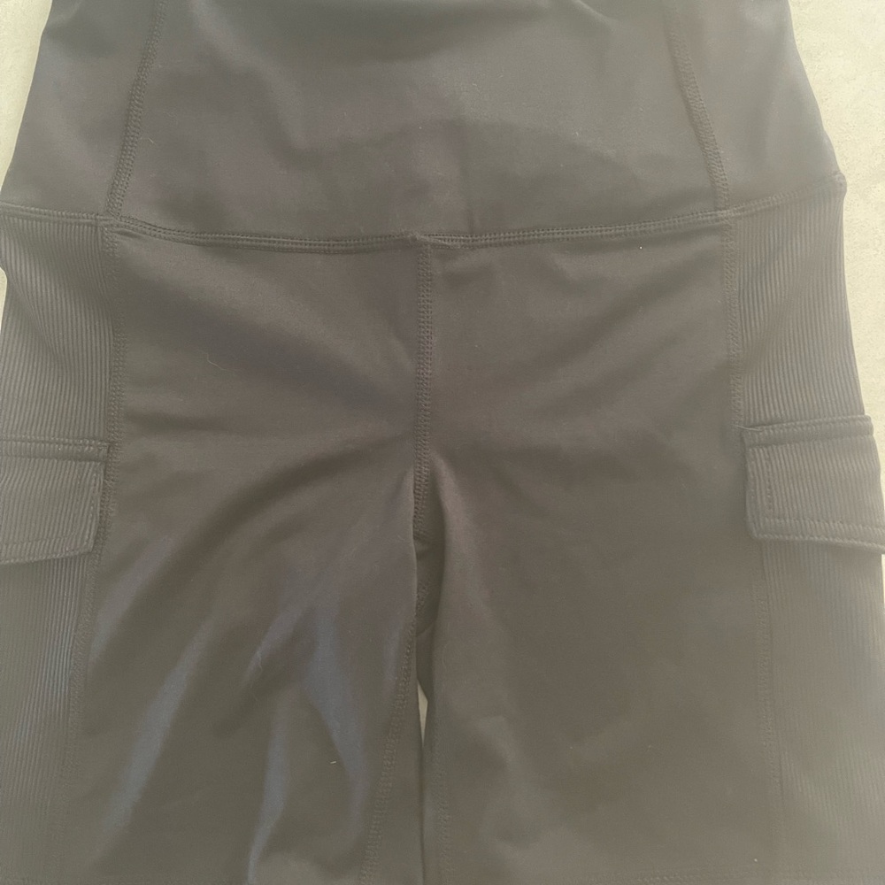 2 pairs of shorts-1 black and 1 teal size women’s small.